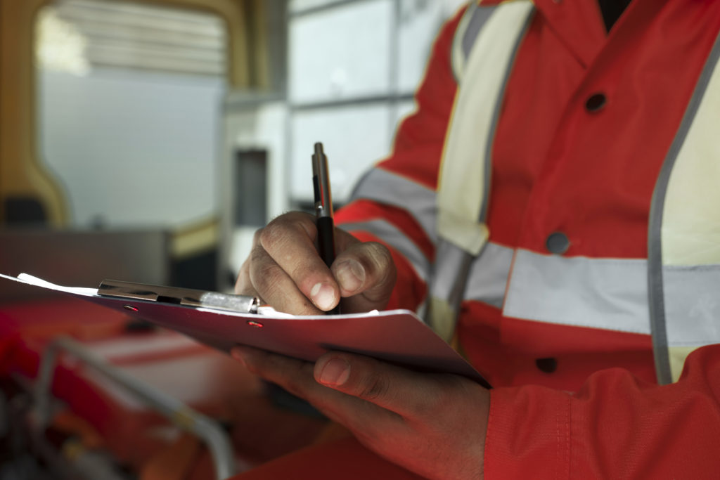 side-view-man-taking-notes-ambulance-car.jpg